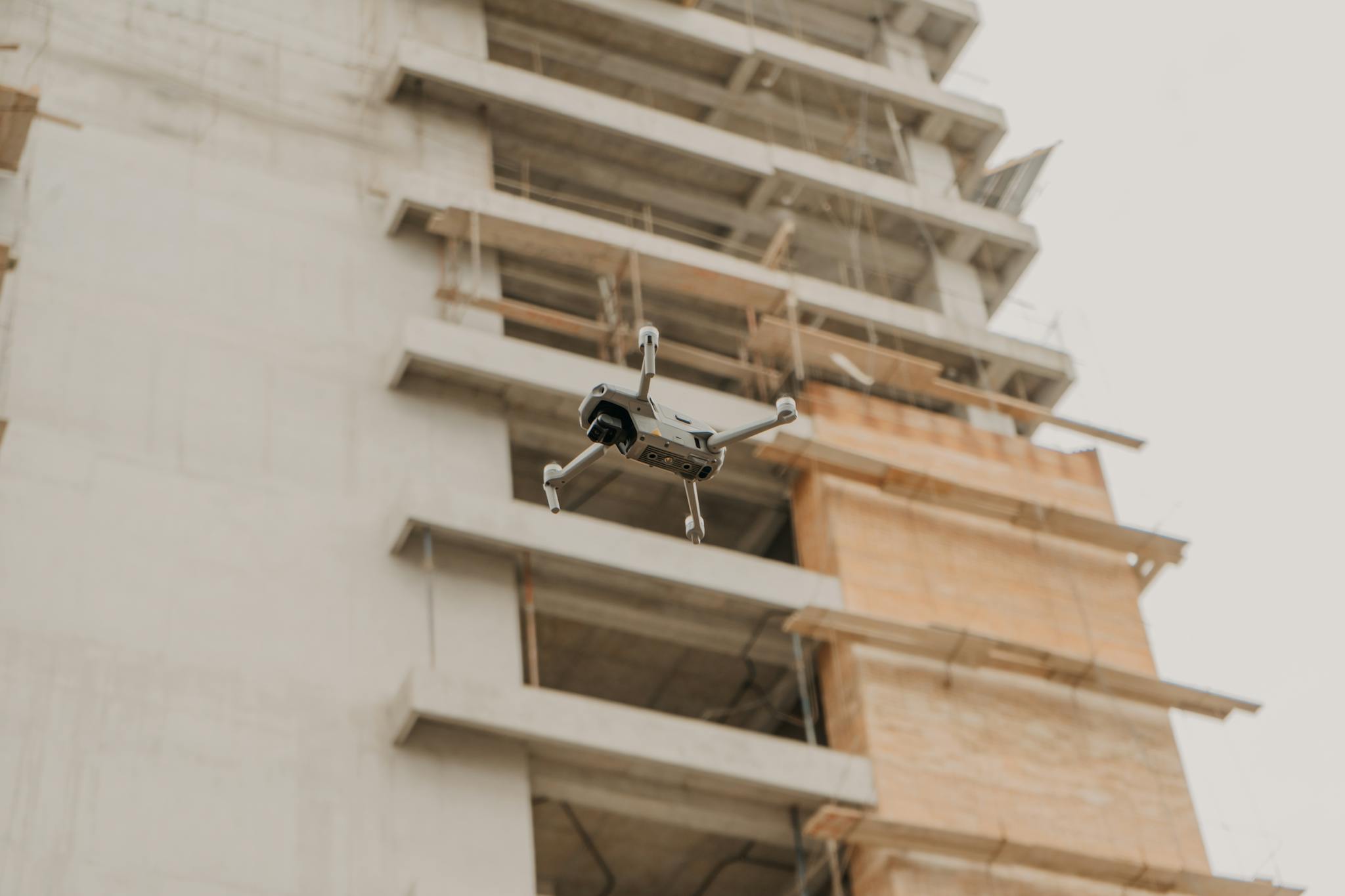 Aerial drone in flight near a construction site in urban Guatemala.